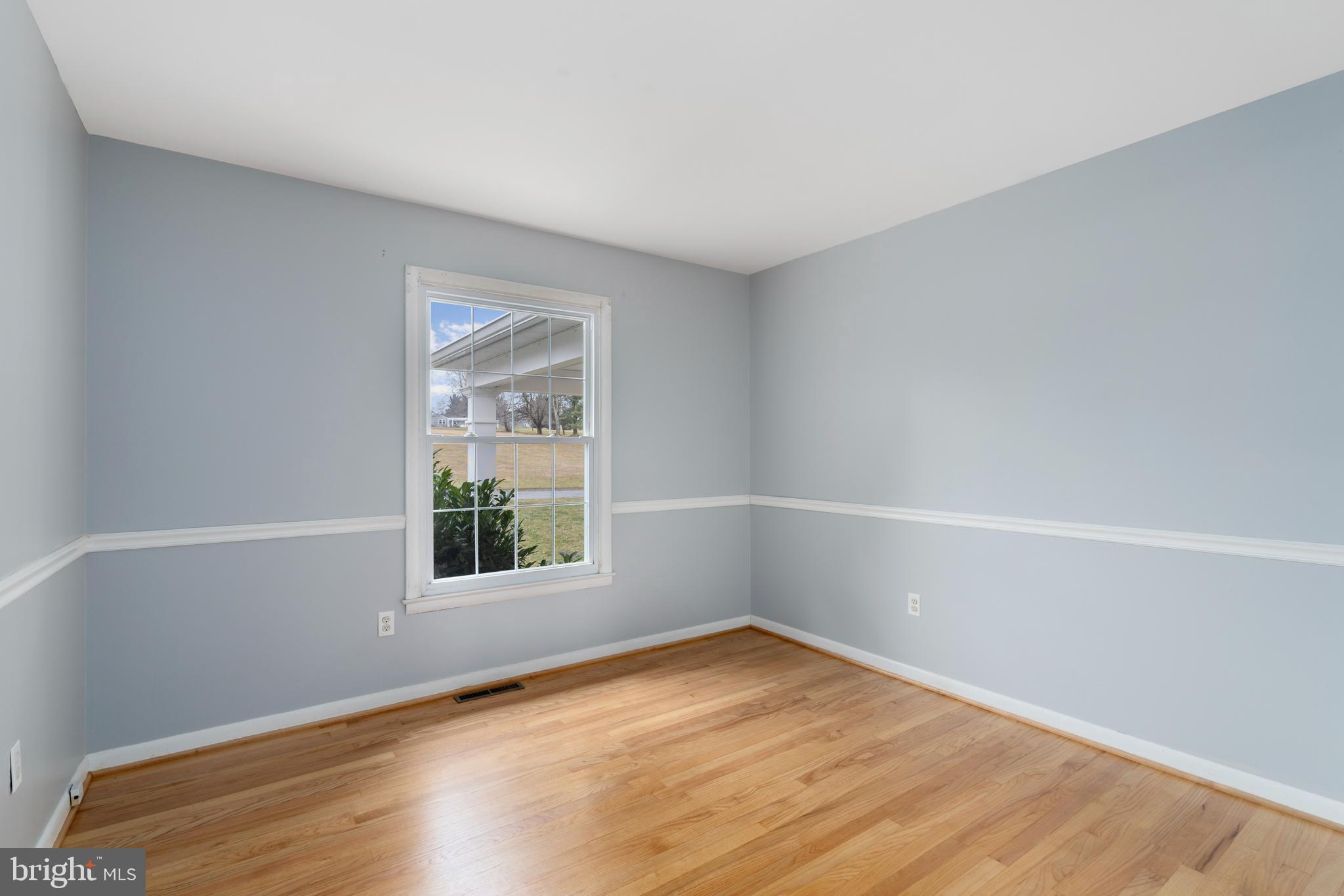 4406 Old Farm Road Baldwin, MD 21013 - Photo 23 of 49 a view of an empty room with wooden floor and a window