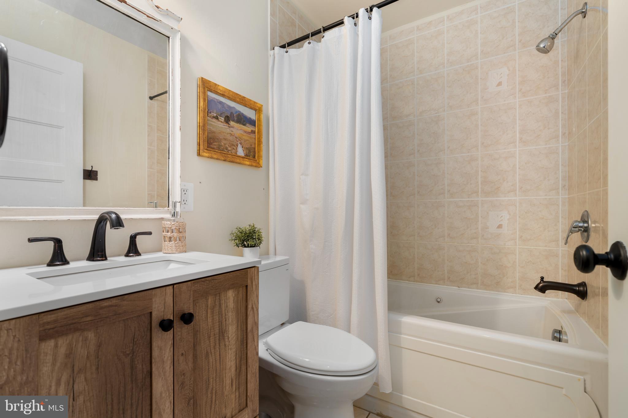 4406 Old Farm Road Baldwin, MD 21013 - Photo 25 of 49 a bathroom with a sink toilet and shower