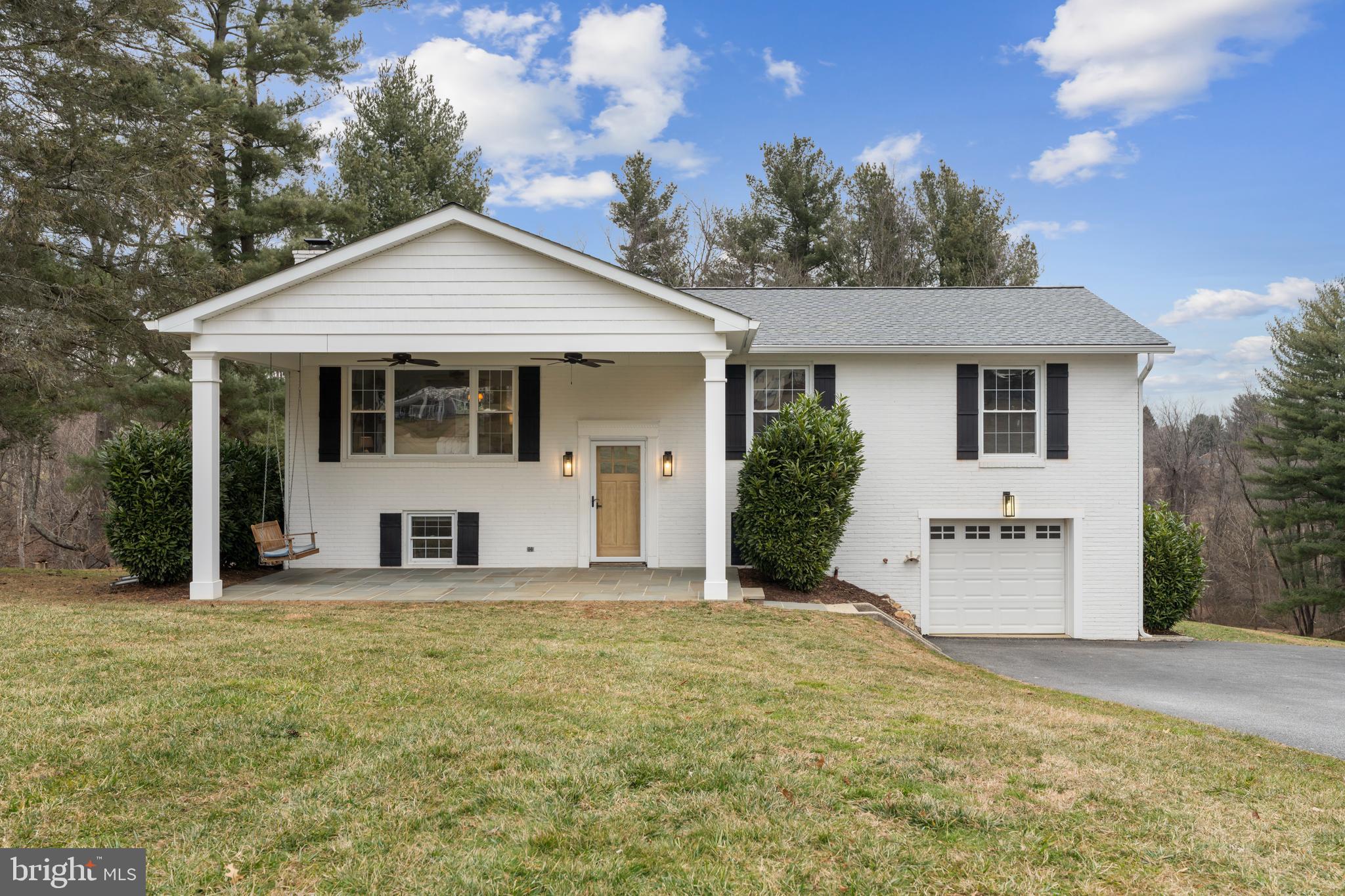 4406 Old Farm Road Baldwin, MD 21013 - Photo 3 of 49 a front view of a house with a yard and garage