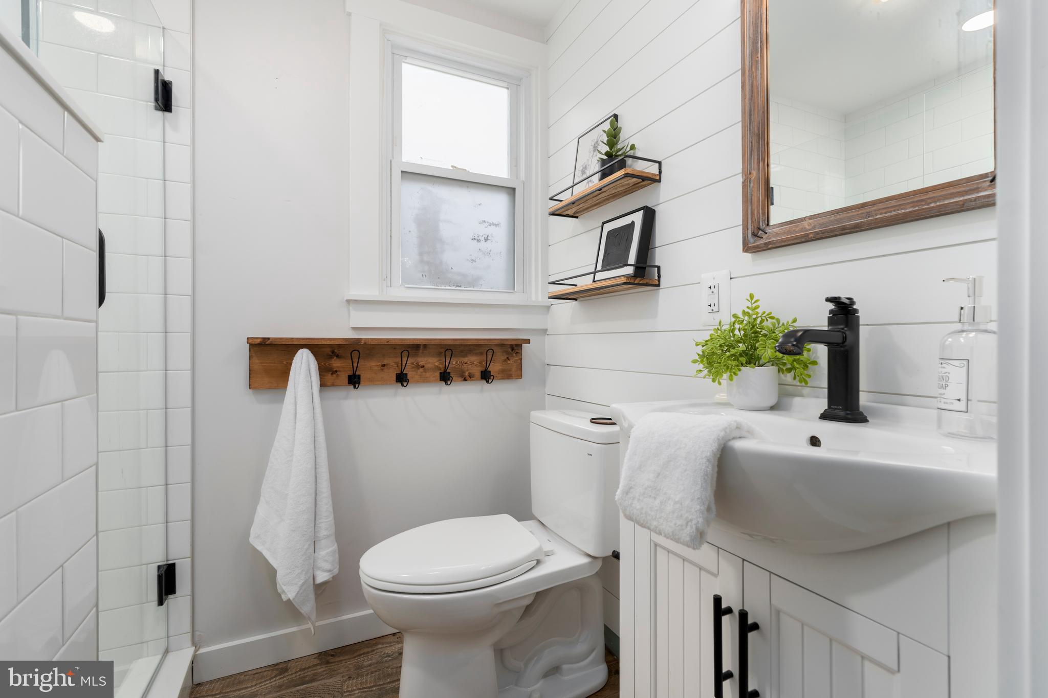 4406 Old Farm Road Baldwin, MD 21013 - Photo 32 of 49 a white toilet sitting next to a bathroom sink