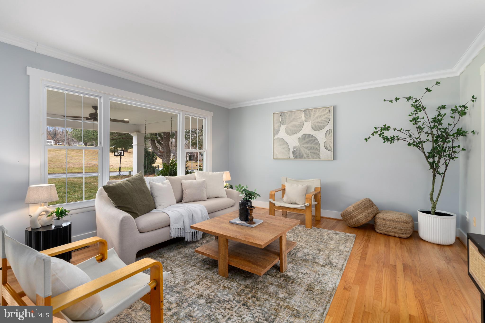 4406 Old Farm Road Baldwin, MD 21013 - Photo 10 of 49 a living room with furniture a table and a potted plant