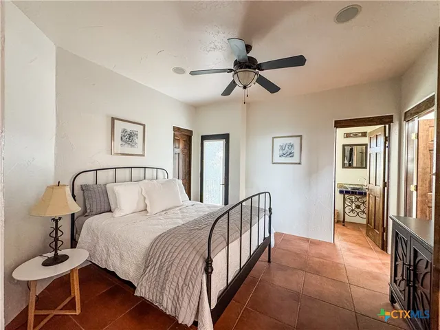 a view of a yard with plants and trees