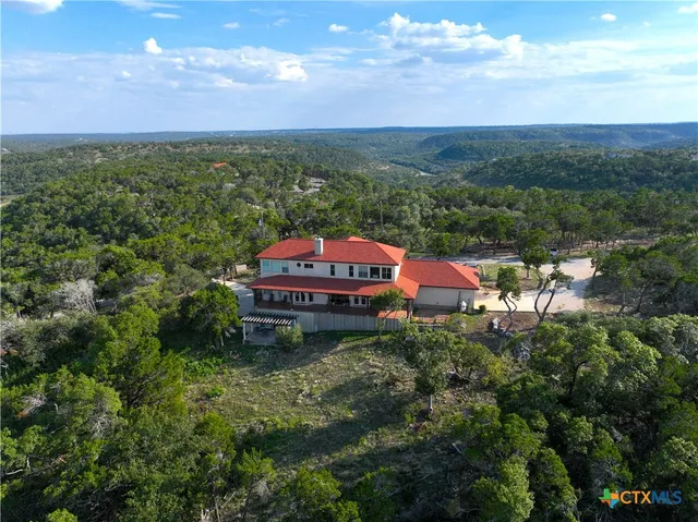 a kitchen with stainless steel appliances a sink and a stove