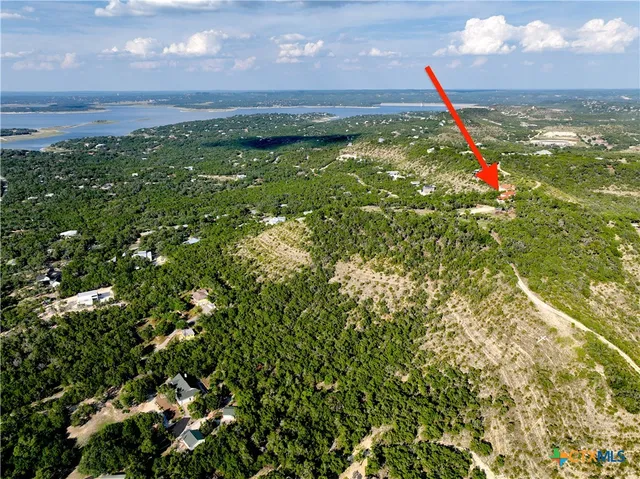 a kitchen with stainless steel appliances granite countertop a stove a sink a oven a dining table and chairs