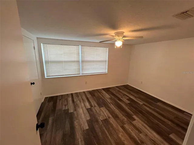 a bathroom with a double vanity sink toilet and shower