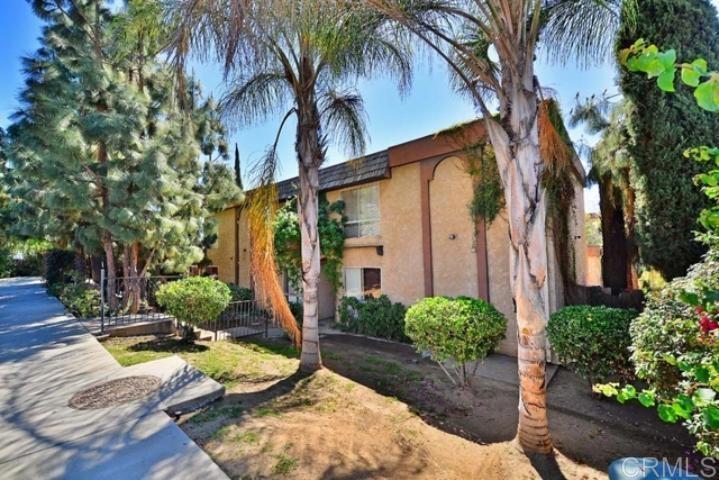 a view of a backyard with potted plants