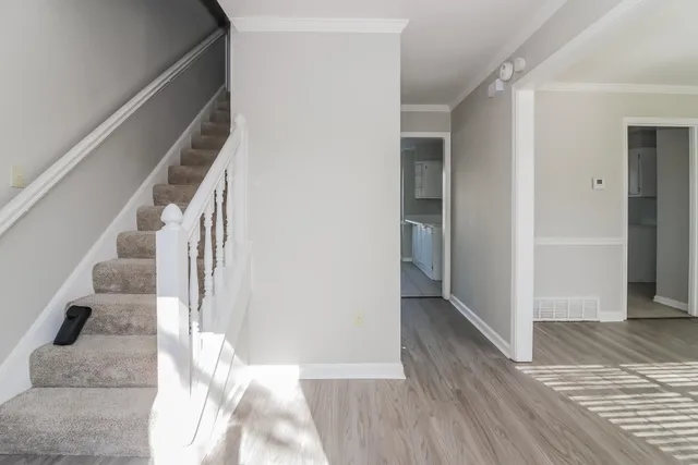 a view of a hallway view with staircase