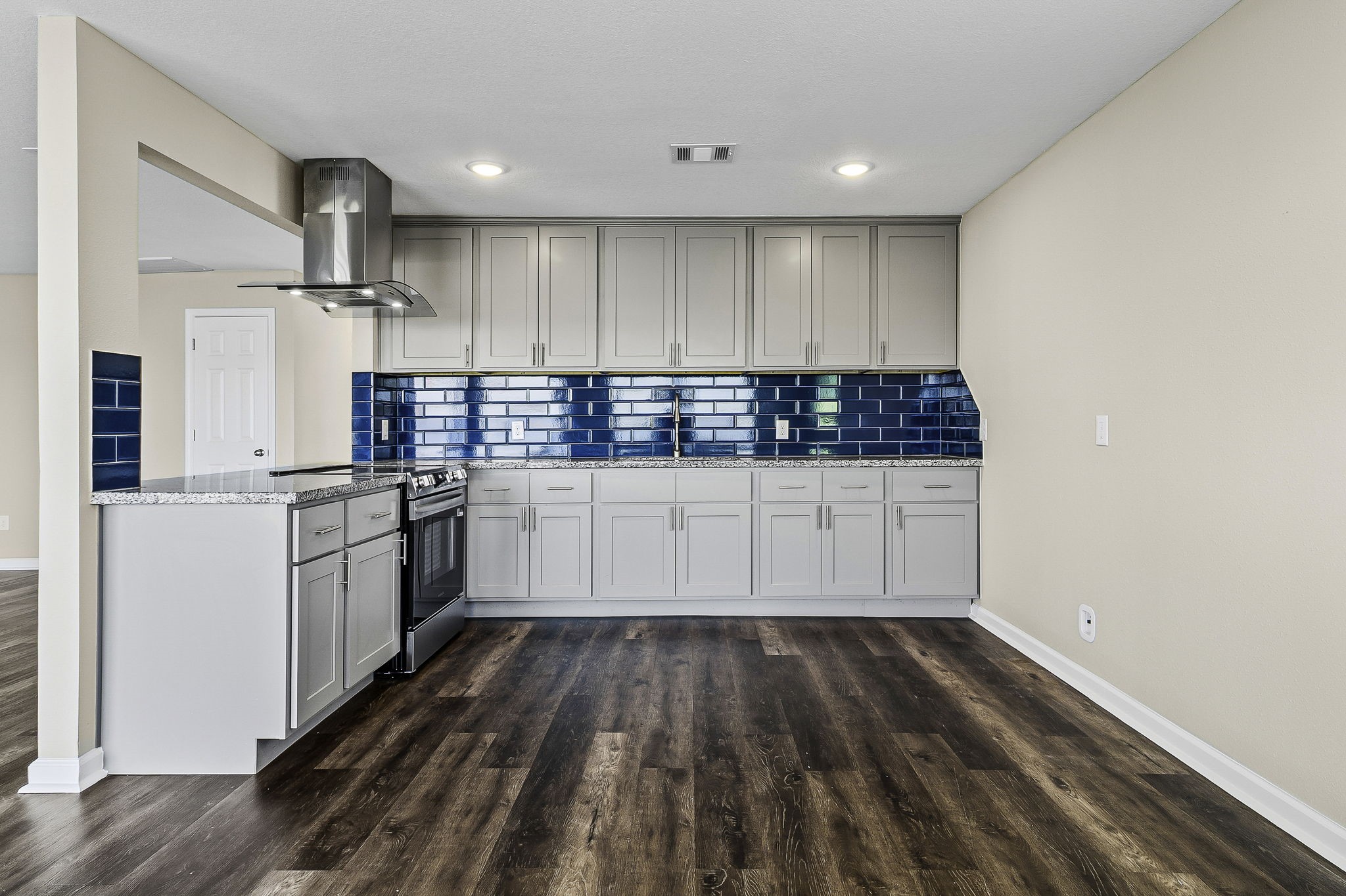 416 Kickapoo Drive Livingston, TX 77351 - Photo 14 of 36 a kitchen with granite countertop white cabinets and white appliances