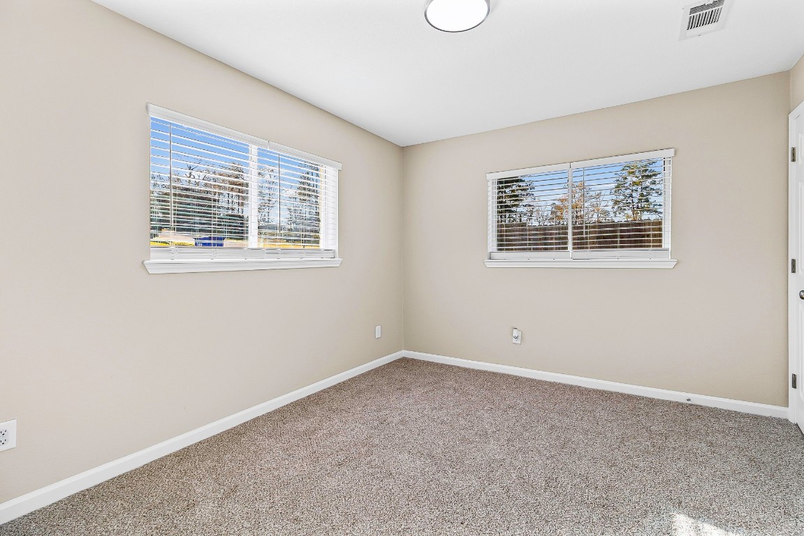 416 Kickapoo Drive Livingston, TX 77351 - Photo 18 of 36 an empty room with a window