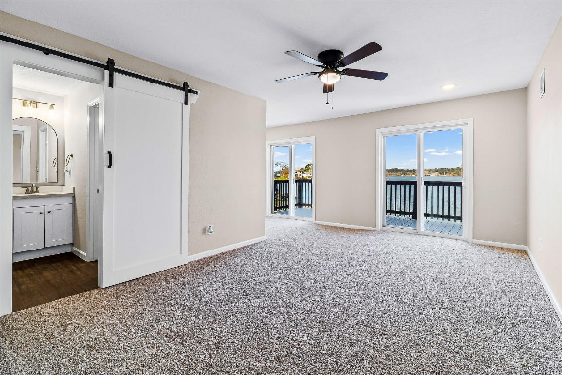 416 Kickapoo Drive Livingston, TX 77351 - Photo 24 of 36 a view of livingroom with hardwood floor and a ceiling fan