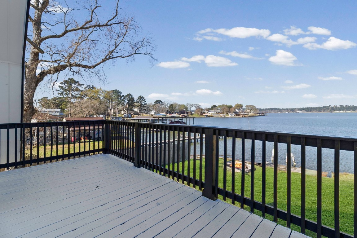 416 Kickapoo Drive Livingston, TX 77351 - Photo 27 of 36 a view of a balcony with wooden fence