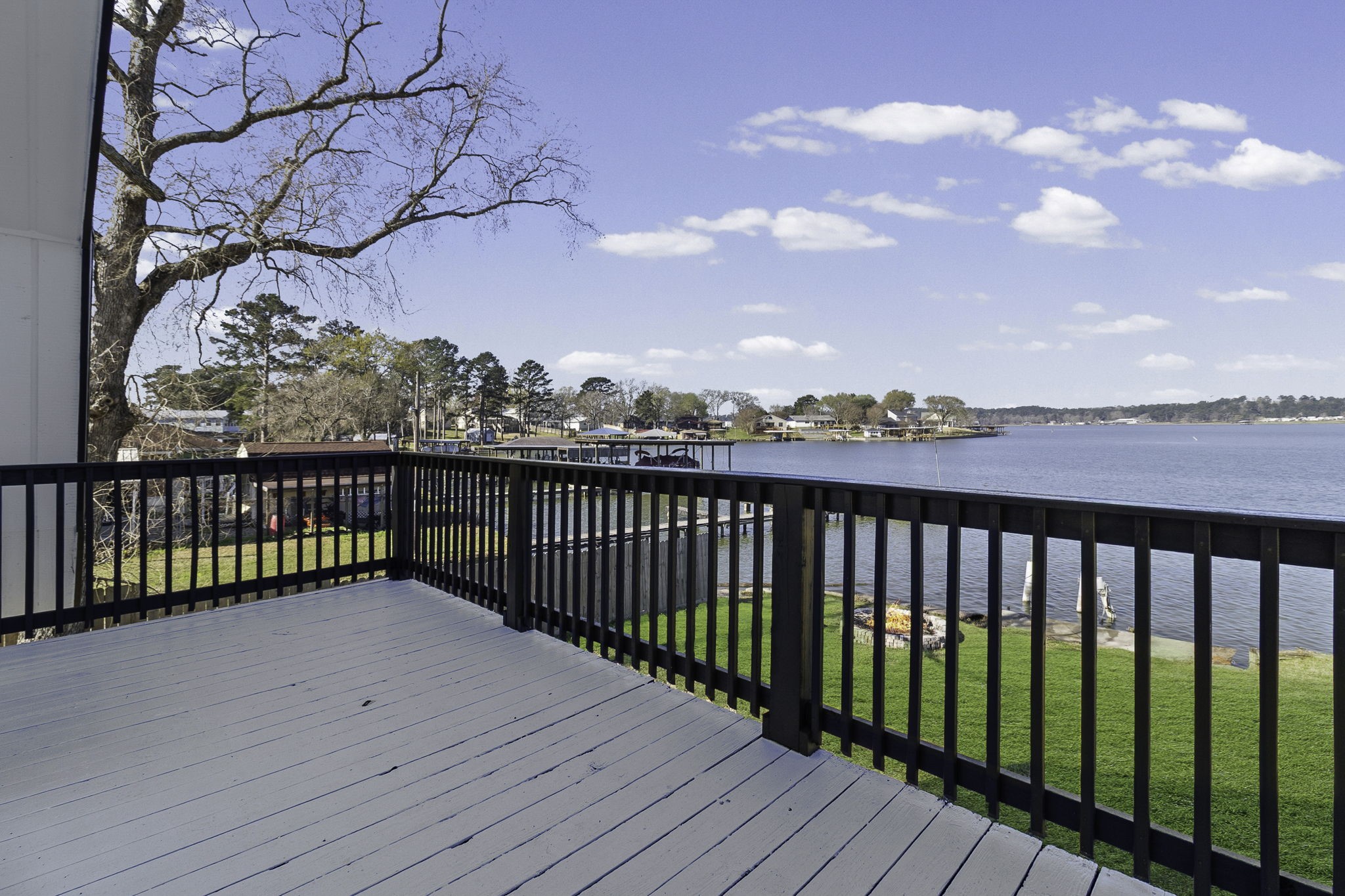 416 Kickapoo Drive Livingston, TX 77351 - Photo 27 of 36 a view of a balcony with wooden fence