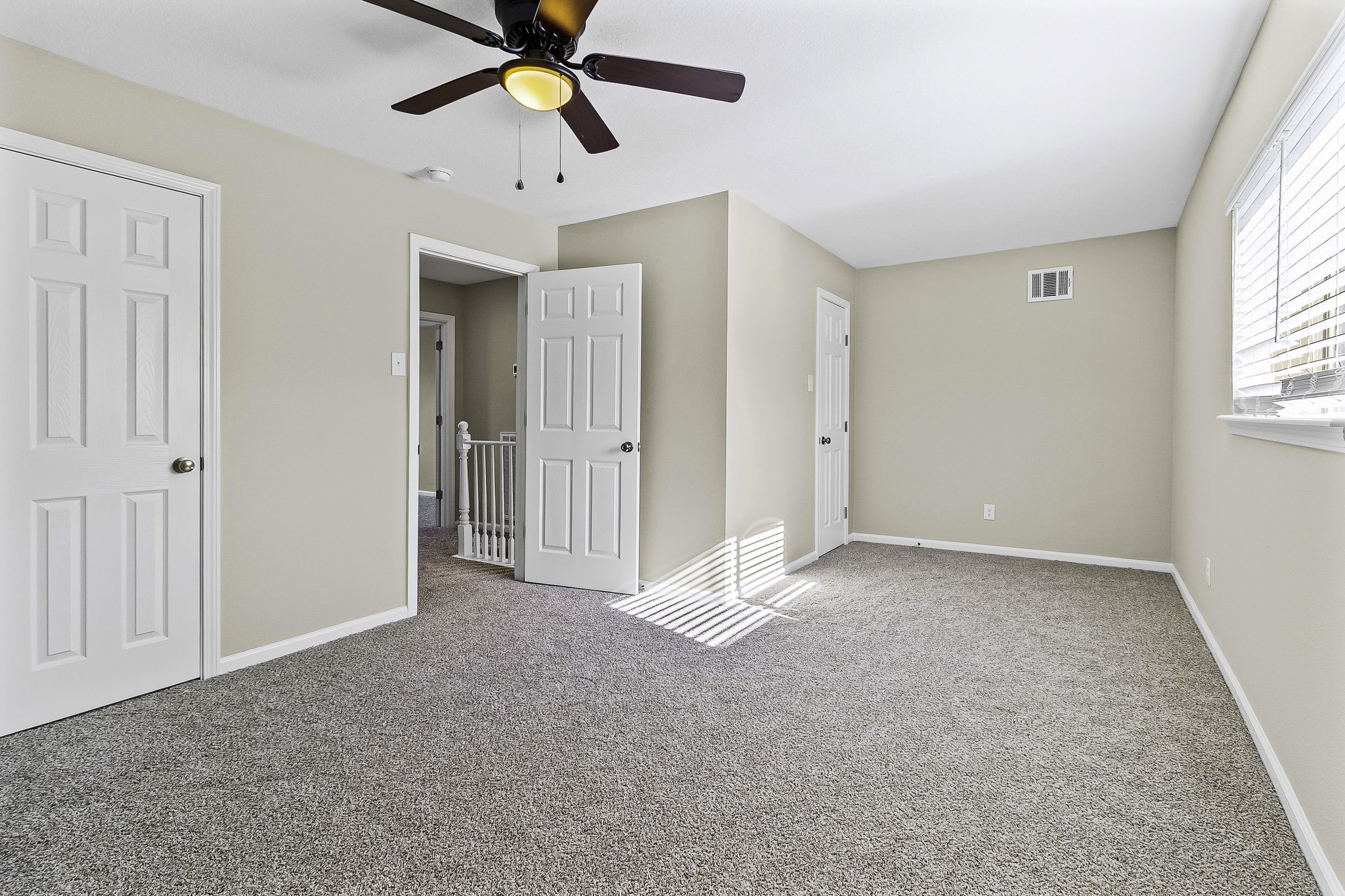 416 Kickapoo Drive Livingston, TX 77351 - Photo 30 of 36 a view of an empty room and window with a chandelier fan