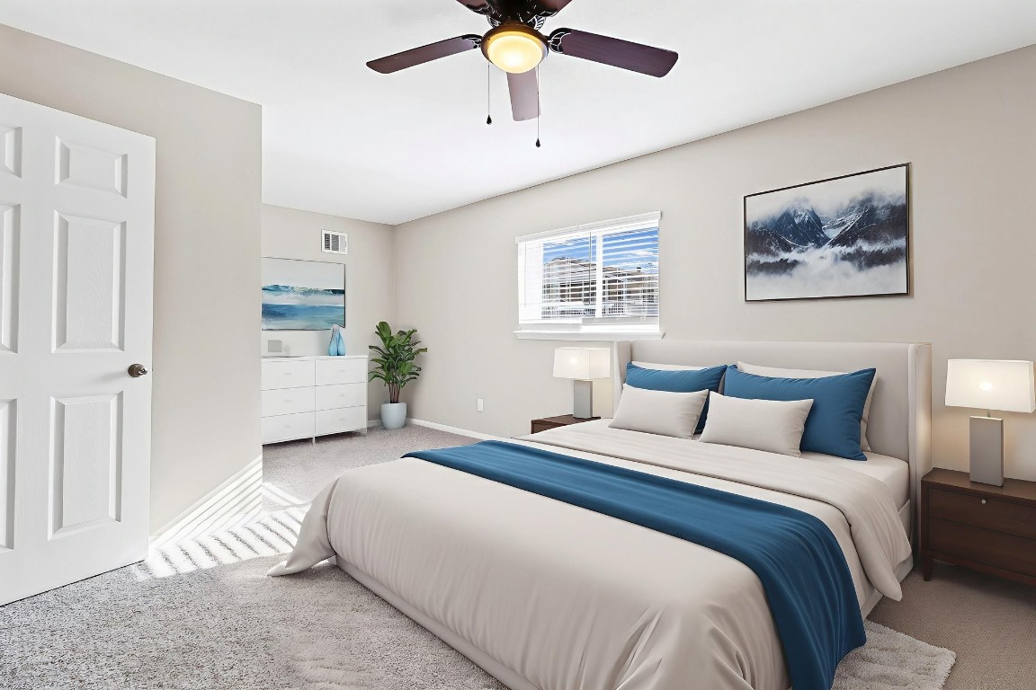 416 Kickapoo Drive Livingston, TX 77351 - Photo 31 of 36 a bedroom with a large bed and a chandelier