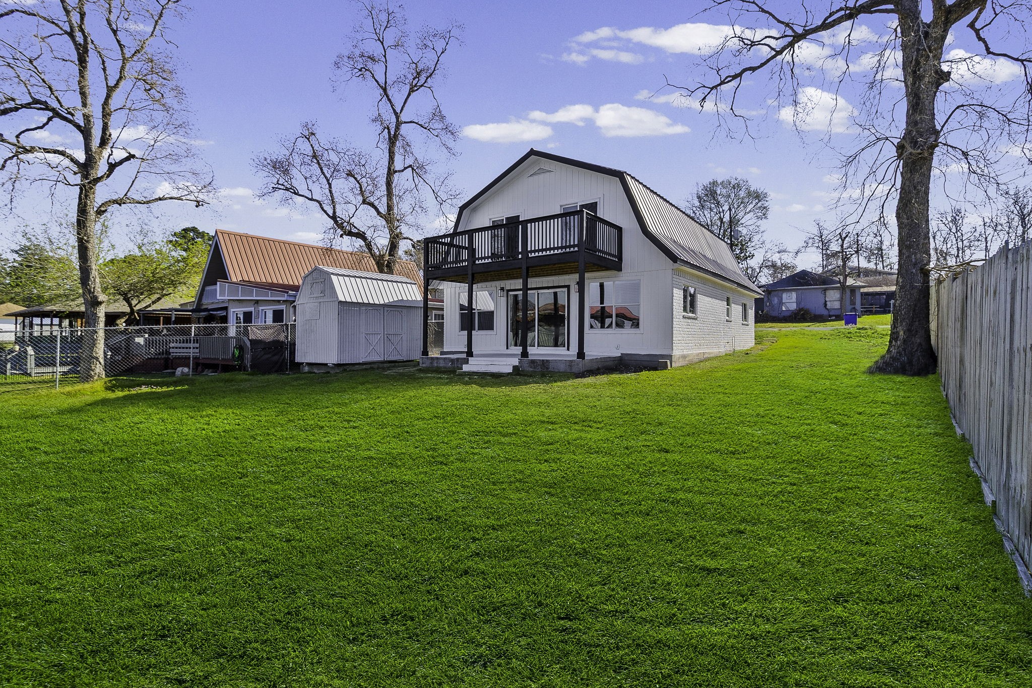 416 Kickapoo Drive Livingston, TX 77351 - Photo 4 of 36 a view of a house with a big yard with large tree
