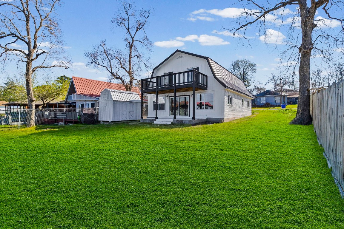 416 Kickapoo Drive Livingston, TX 77351 - Photo 4 of 36 a view of a house with a big yard with large tree