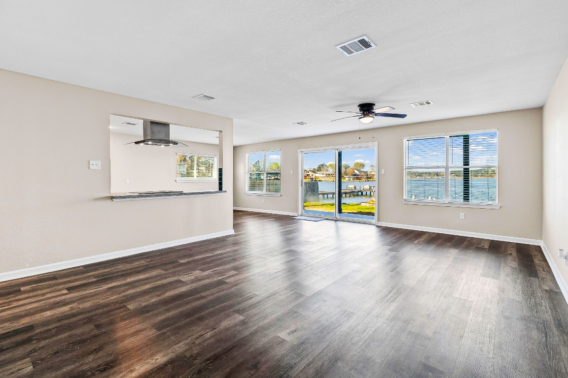 416 Kickapoo Drive Livingston, TX 77351 - Photo 10 of 36 an empty room with wooden floor and windows