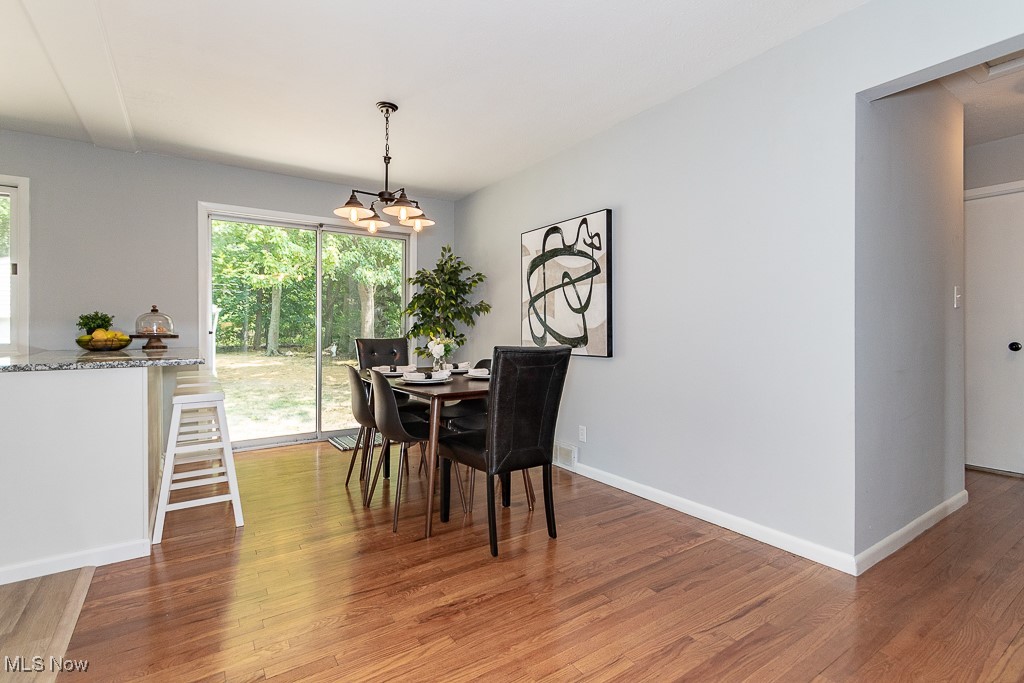32609 Knobel Road Willowick, OH 44095 - Photo 11 of 29 Dining room with hardwood floors and slider to outdoor stone patio