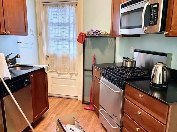a kitchen with a stove and a microwave