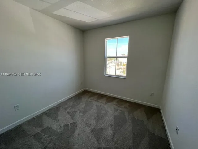 an empty room with a wooden door