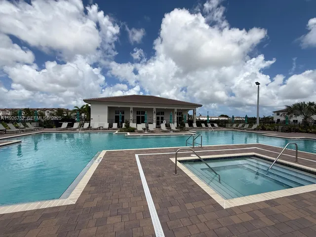 a view of swimming pool from a balcony