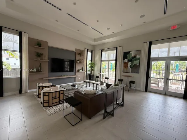 a tall tree in the middle of a field