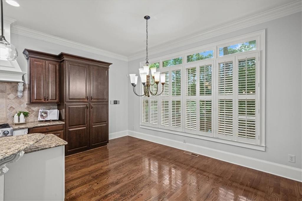 3594 North Druid Hills Road Decatur, GA 30033 - Photo 12 of 57 a view of a kitchen with granite countertop wooden cabinets and a window
