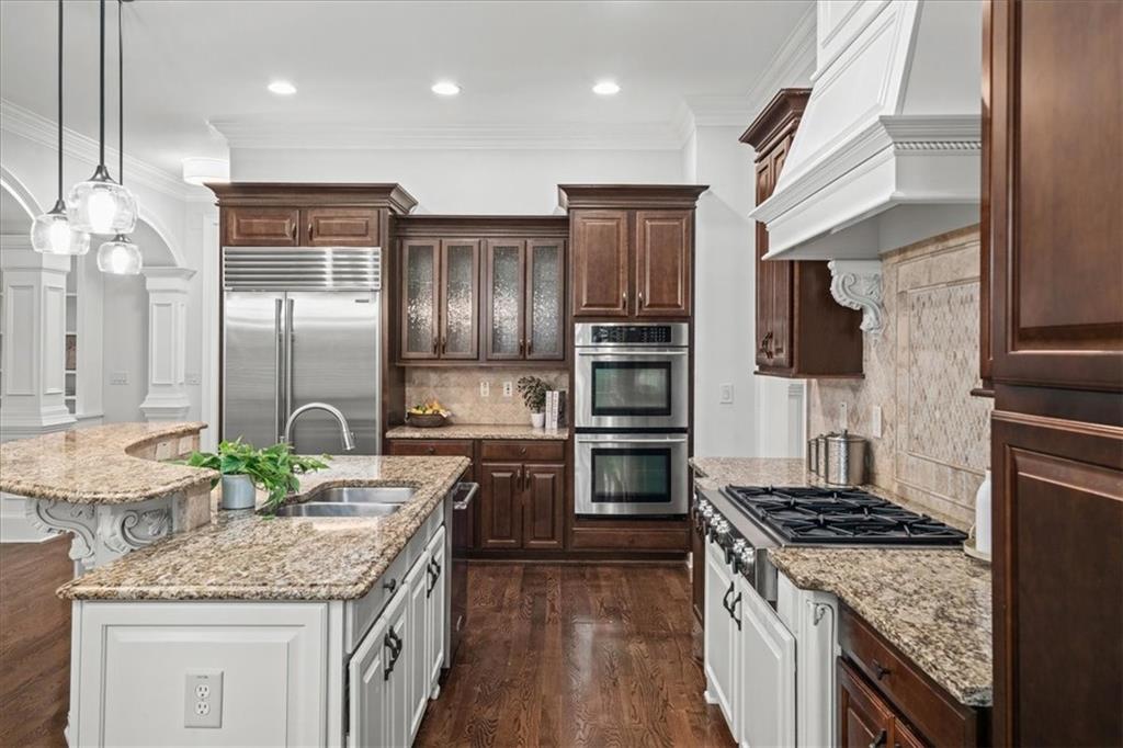 3594 North Druid Hills Road Decatur, GA 30033 - Photo 13 of 57 a kitchen with stainless steel appliances granite countertop a sink stove and refrigerator