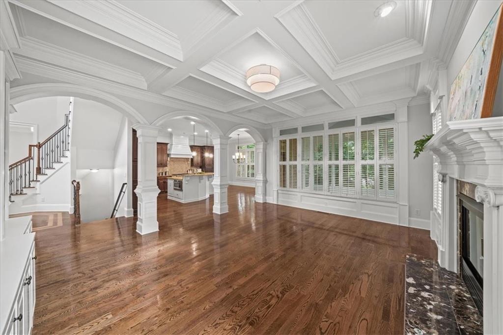 3594 North Druid Hills Road Decatur, GA 30033 - Photo 18 of 57 a view of an empty room with wooden floor and a fireplace