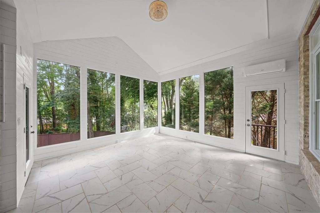 3594 North Druid Hills Road Decatur, GA 30033 - Photo 20 of 57 a view of an empty room with windows and yard