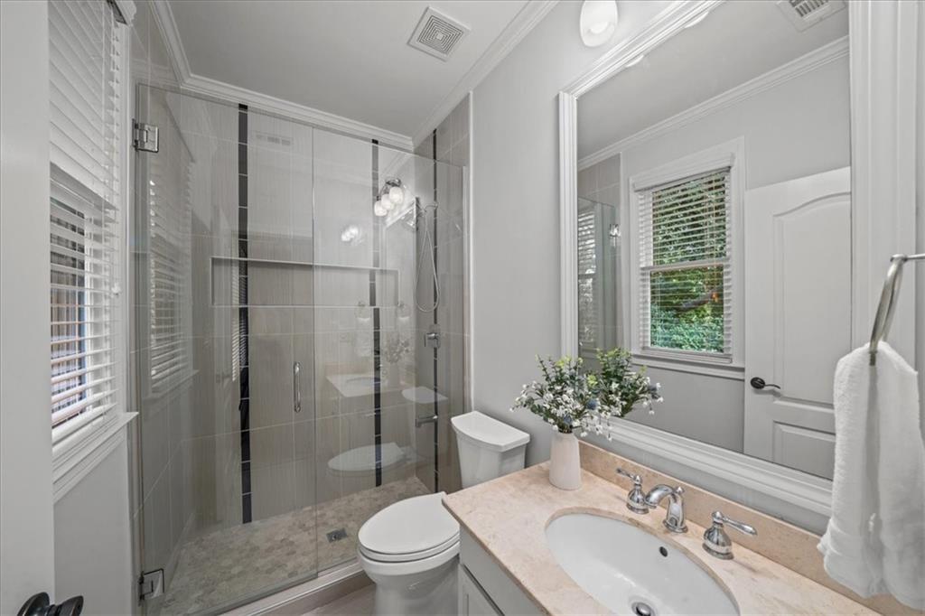 3594 North Druid Hills Road Decatur, GA 30033 - Photo 30 of 57 a bathroom with a sink toilet and shower