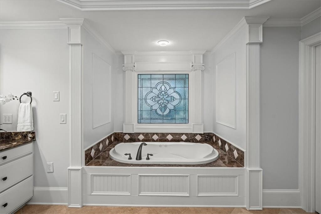 3594 North Druid Hills Road Decatur, GA 30033 - Photo 33 of 57 a bathroom with a bathtub and window