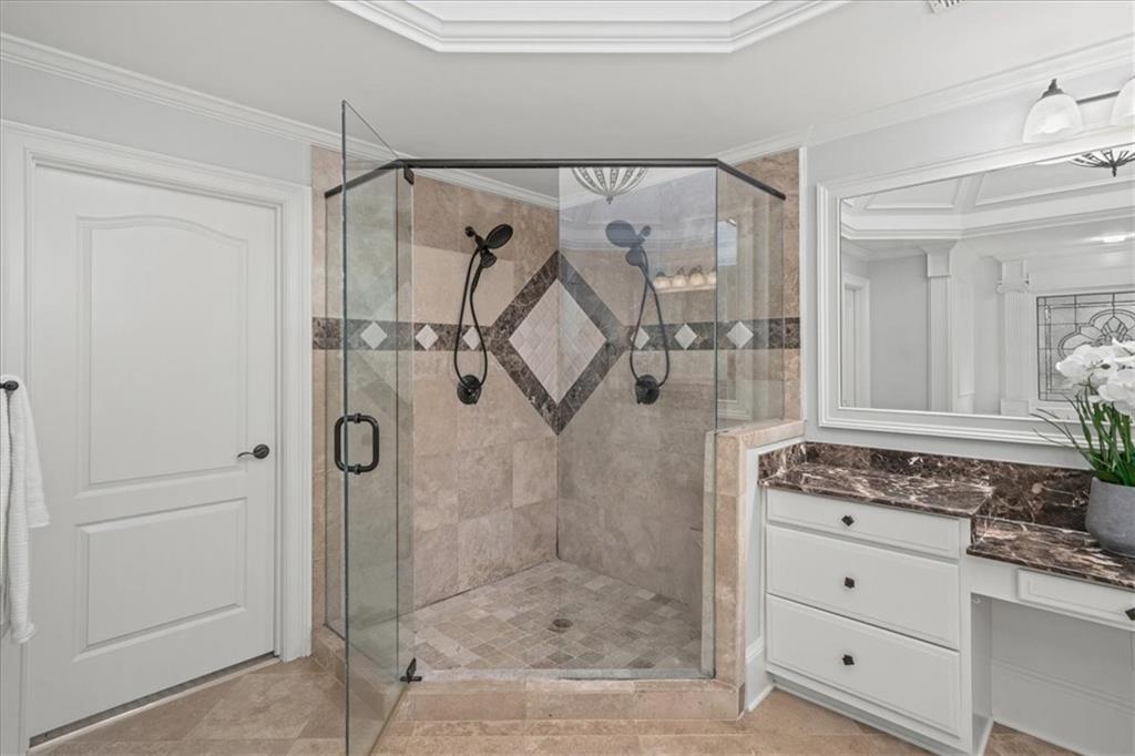 3594 North Druid Hills Road Decatur, GA 30033 - Photo 34 of 57 a bathroom with a shower sink and mirror