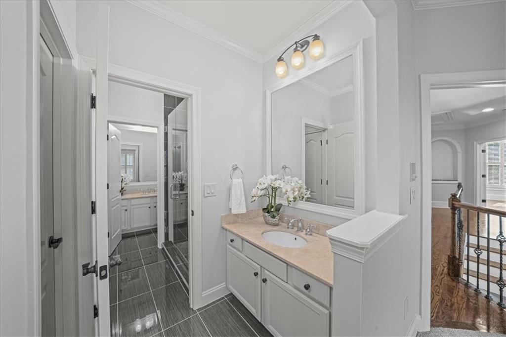 3594 North Druid Hills Road Decatur, GA 30033 - Photo 37 of 57 a bathroom with a double vanity sink mirror and toilet