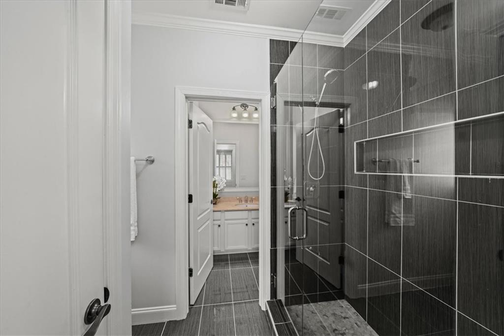 3594 North Druid Hills Road Decatur, GA 30033 - Photo 39 of 57 a bathroom with a glass shower door