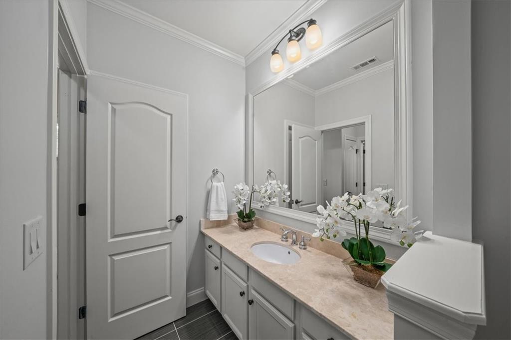 3594 North Druid Hills Road Decatur, GA 30033 - Photo 41 of 57 a bathroom with a granite countertop sink and a mirror