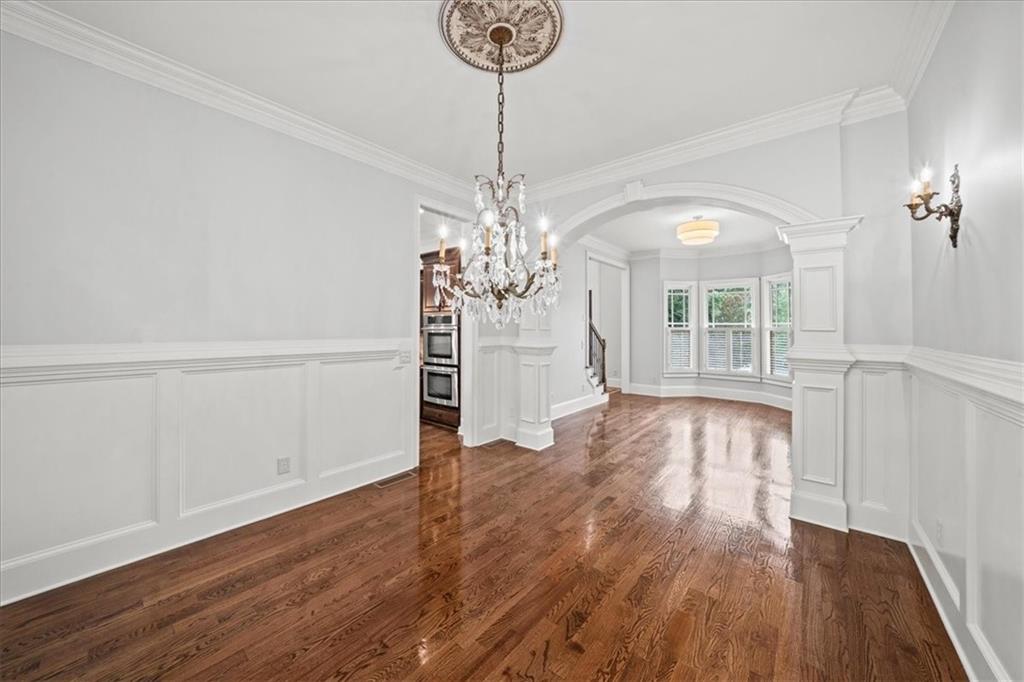 3594 North Druid Hills Road Decatur, GA 30033 - Photo 6 of 57 a view of a room with wooden floor chandelier and windows