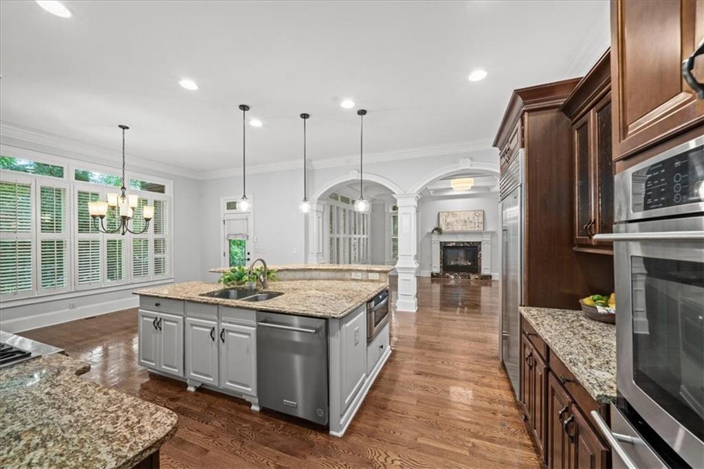 3594 North Druid Hills Road Decatur, GA 30033 - Photo 7 of 57 a kitchen with stainless steel appliances granite countertop a stove a sink and a wooden floors
