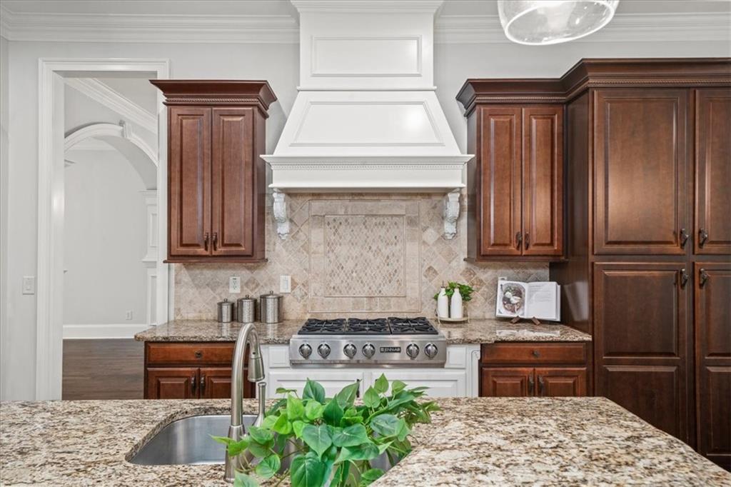 3594 North Druid Hills Road Decatur, GA 30033 - Photo 9 of 57 a kitchen with stainless steel appliances granite countertop a stove and a refrigerator