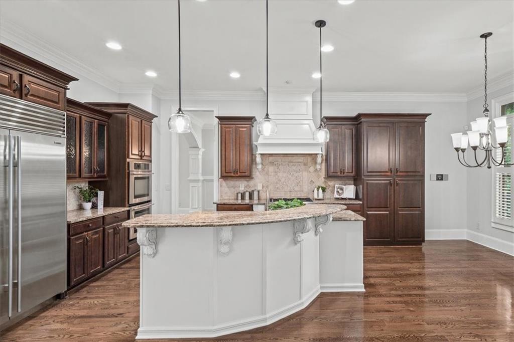 3594 North Druid Hills Road Decatur, GA 30033 - Photo 10 of 57 a kitchen with stainless steel appliances granite countertop a refrigerator a sink a stove and a wooden floors