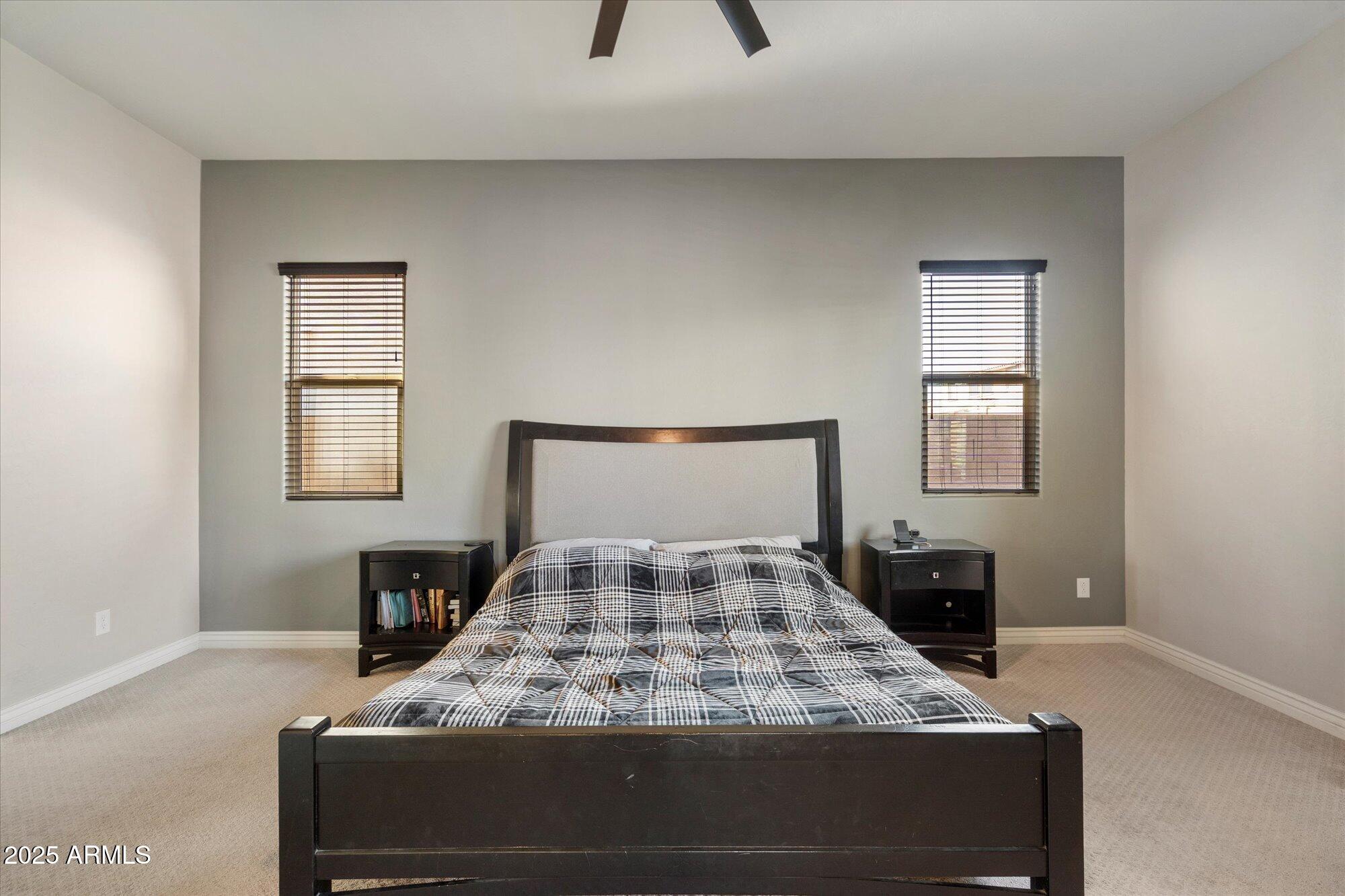 7424 West Jasmine Trail Peoria, AZ 85383 - Photo 12 of 30 a bedroom with a bed and a window
