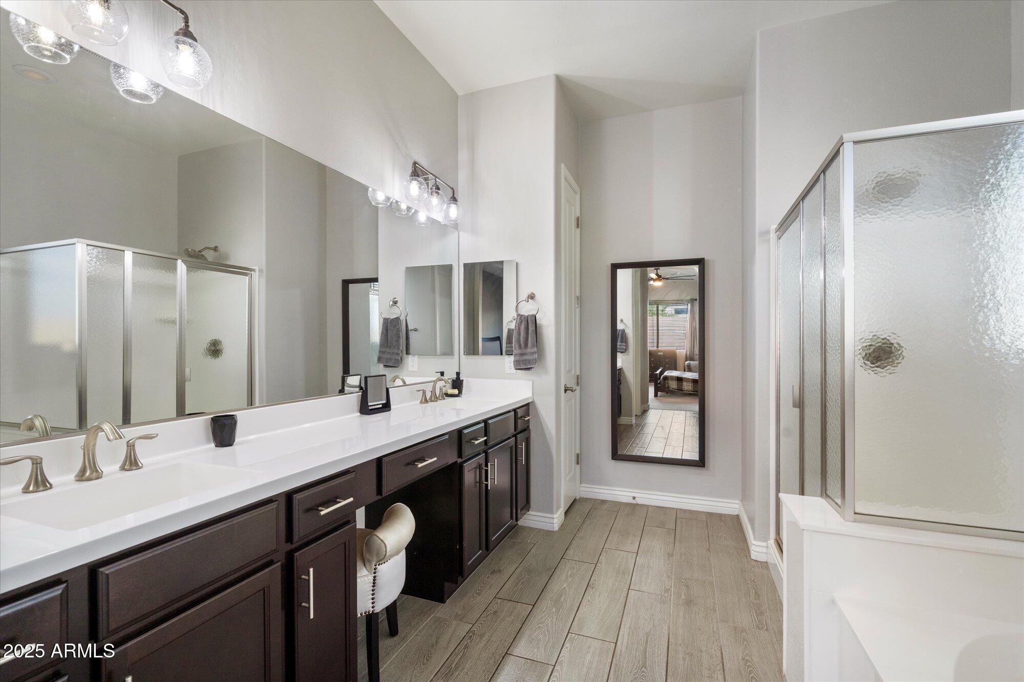 7424 West Jasmine Trail Peoria, AZ 85383 - Photo 15 of 30 a spacious bathroom with a double vanity sink a and a mirror
