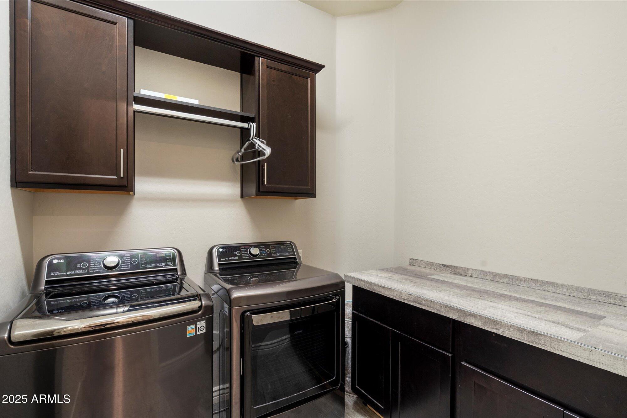 7424 West Jasmine Trail Peoria, AZ 85383 - Photo 24 of 30 a kitchen with a stove and a microwave