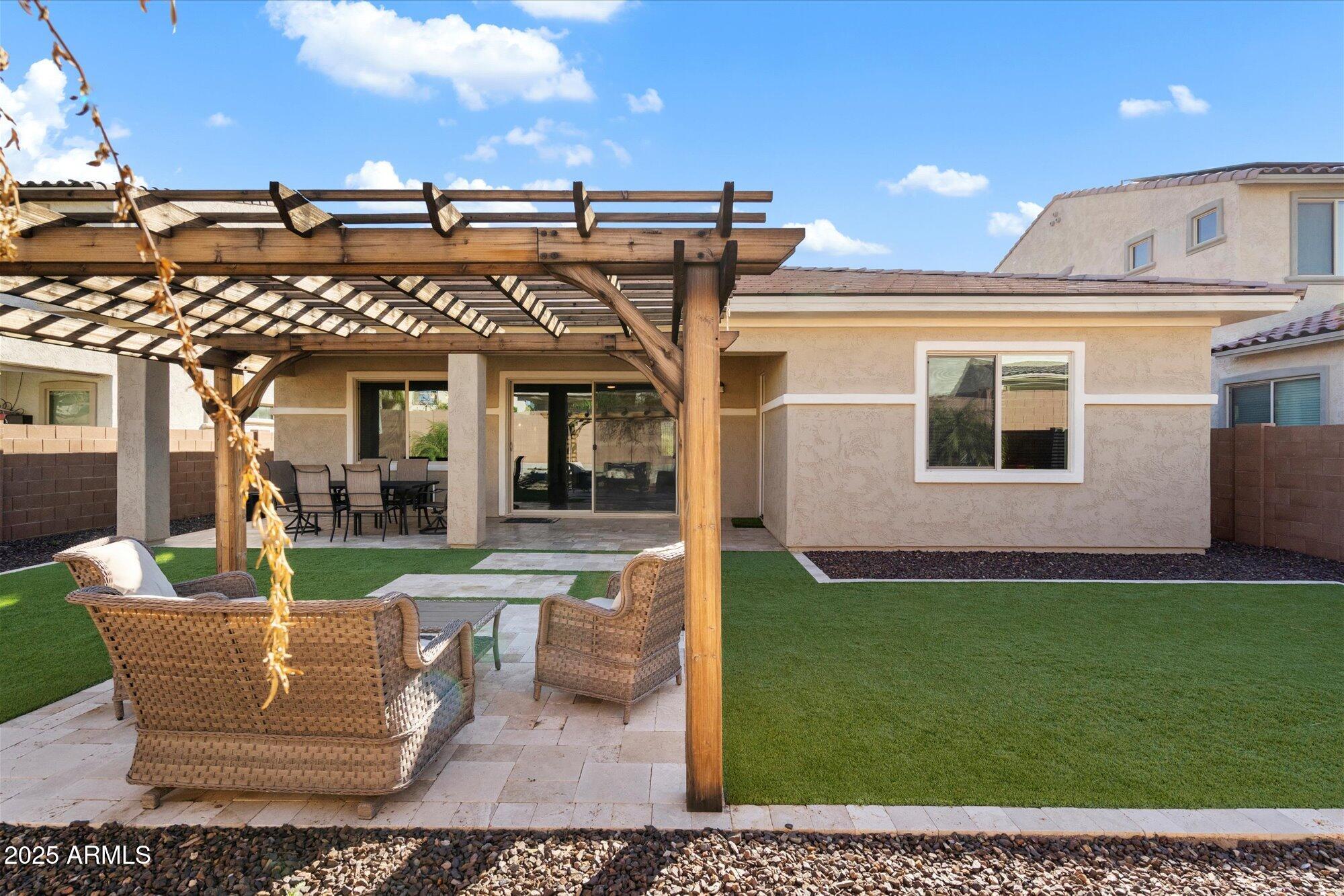 7424 West Jasmine Trail Peoria, AZ 85383 - Photo 26 of 30 a view of a patio with couches chairs and potted plants