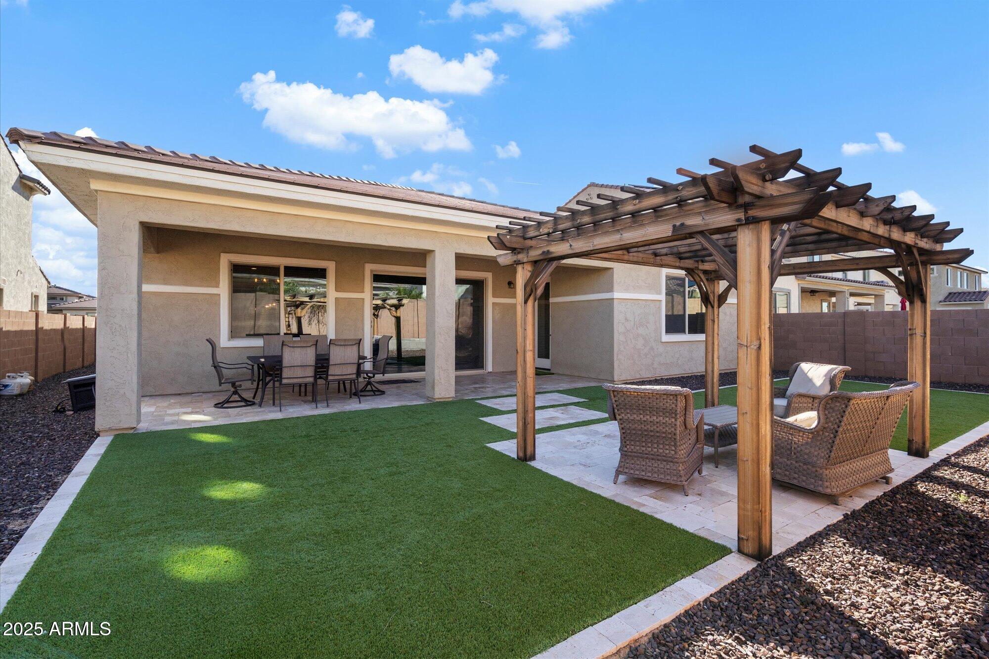 7424 West Jasmine Trail Peoria, AZ 85383 - Photo 27 of 30 a view of a porch with a table and chairs