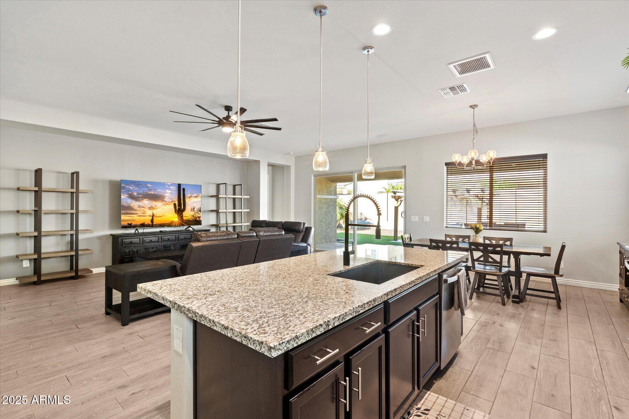 7424 West Jasmine Trail Peoria, AZ 85383 - Photo 9 of 30 a kitchen with sink table and chairs