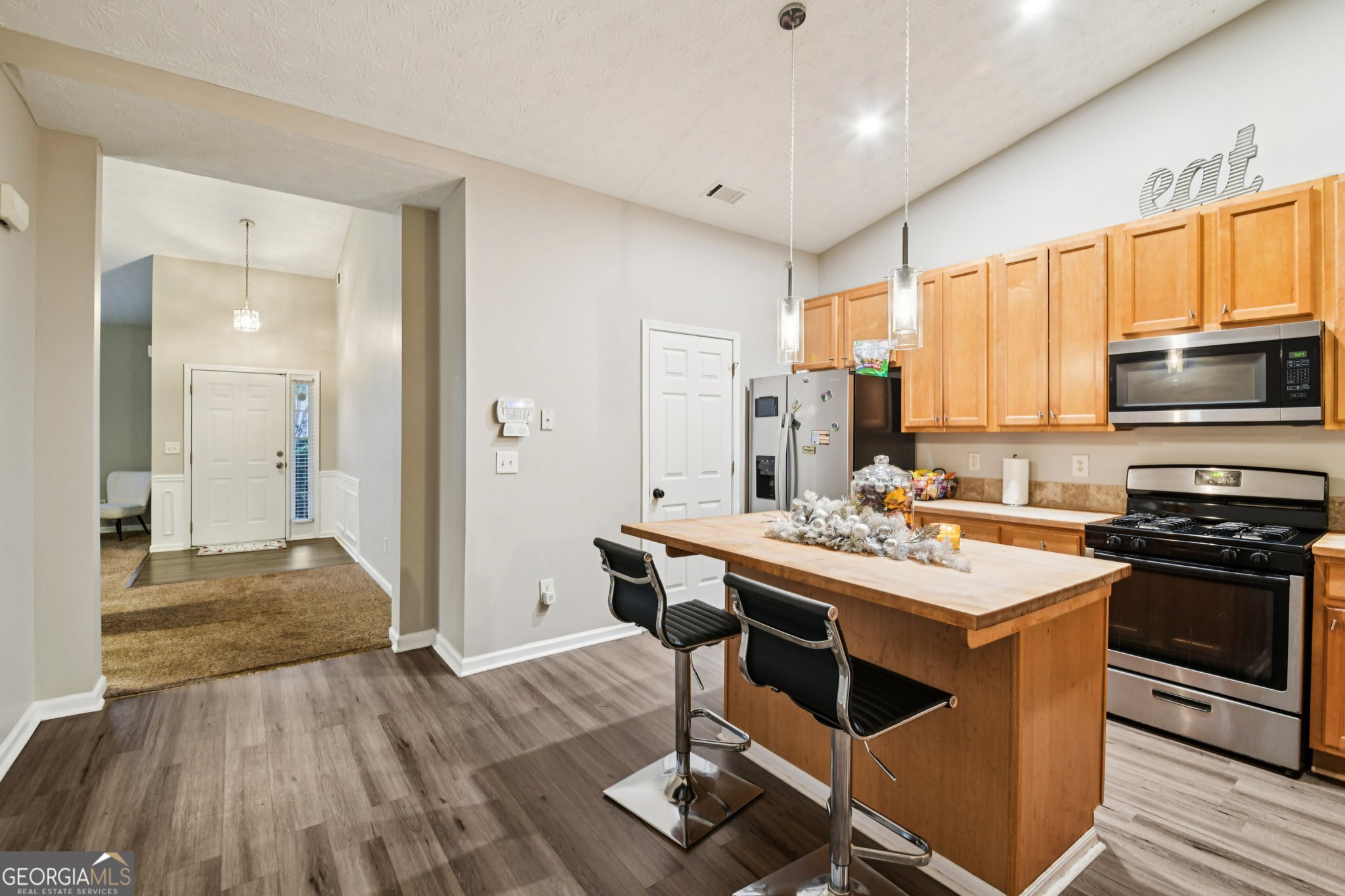 564 Goldfinch Way Stockbridge, GA 30281 - Photo 11 of 31 a view of a kitchen counter space and wooden floor