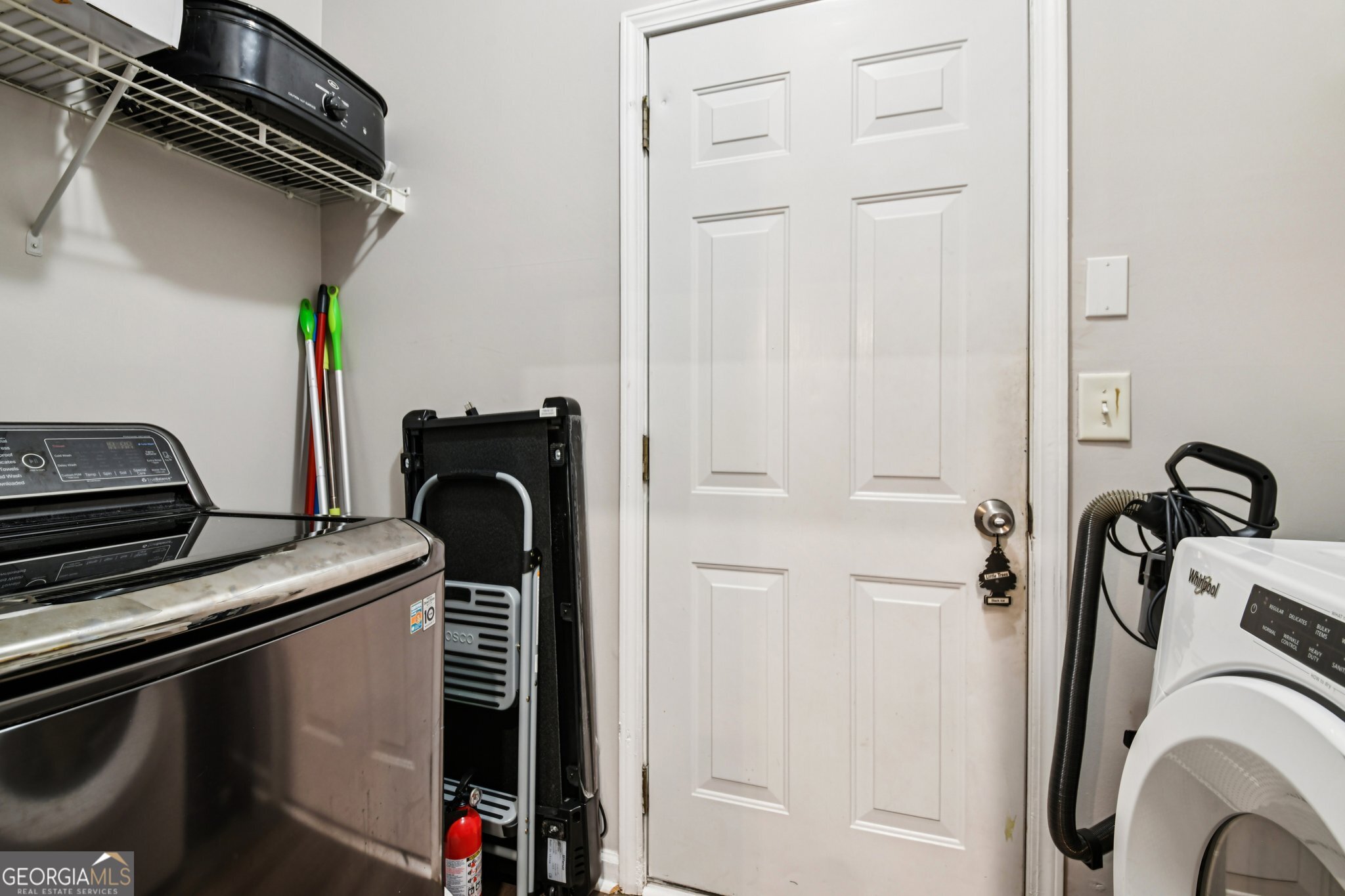 564 Goldfinch Way Stockbridge, GA 30281 - Photo 15 of 31 a view of a storage and utility room with washer and dryer