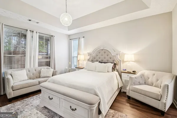 a bedroom with a bed and a couch