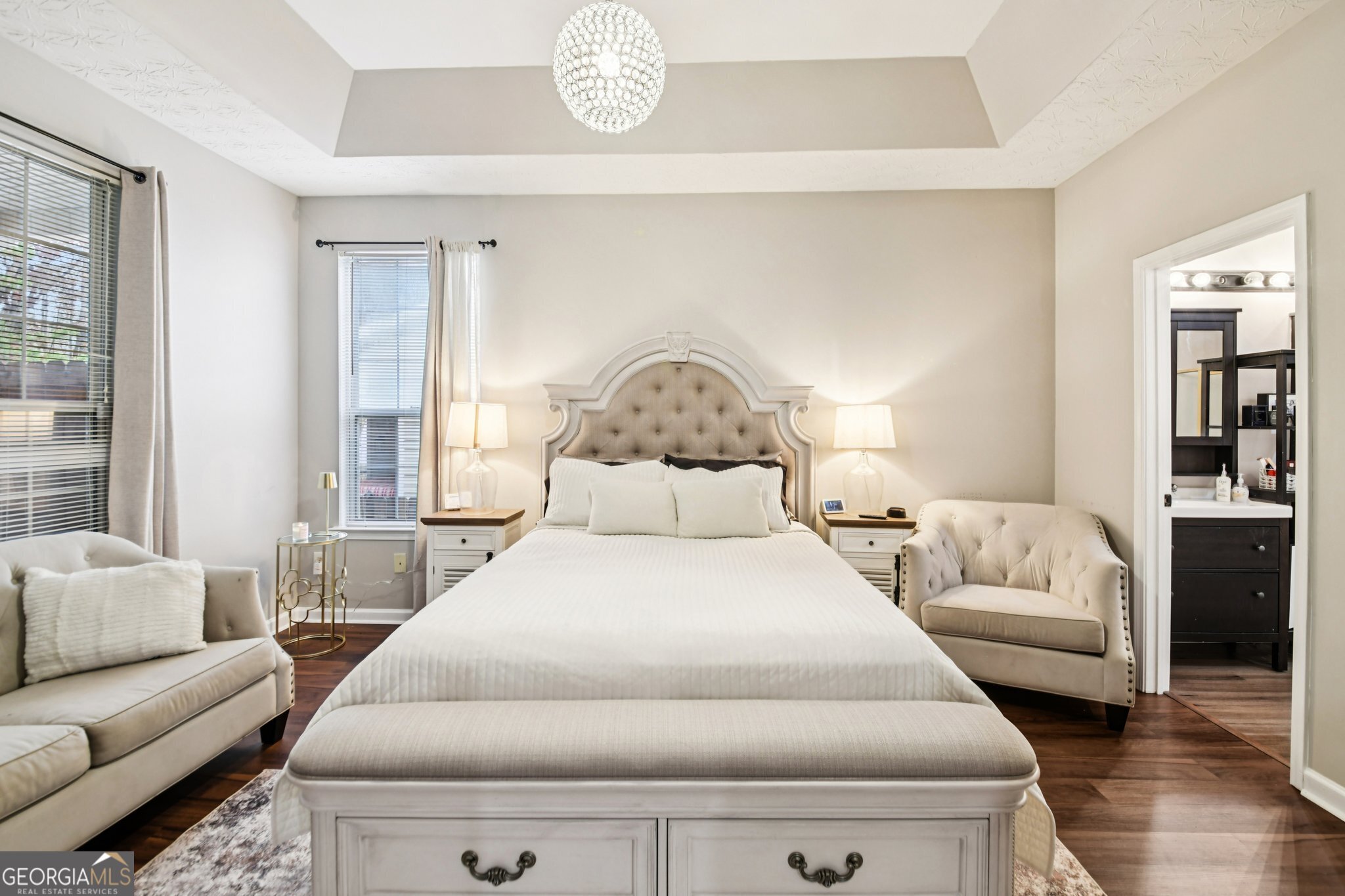 564 Goldfinch Way Stockbridge, GA 30281 - Photo 17 of 31 a bedroom with a bed and wooden floor